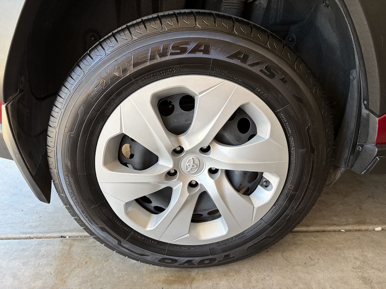 Clean car tire and silver wheel